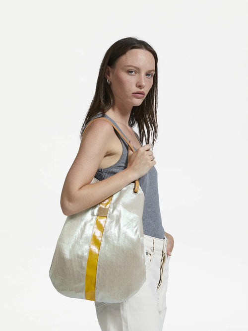 Premium Adaia Basket Tote Deep Crema designer handbag on model cream bottom navy blue shiny finish linen