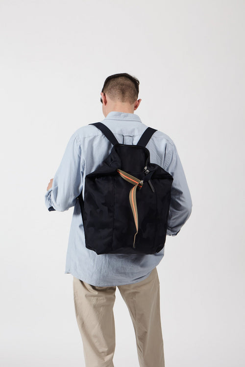 man with designer backpack 