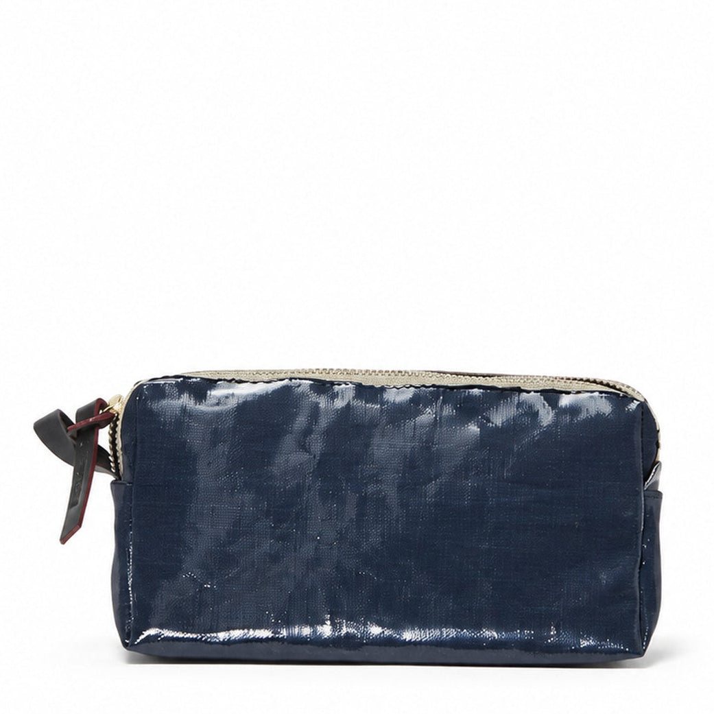A small navy blue leather pouch with a top zipper and a dark brown leather ribbon detail on the left side, shown against a plain white background.