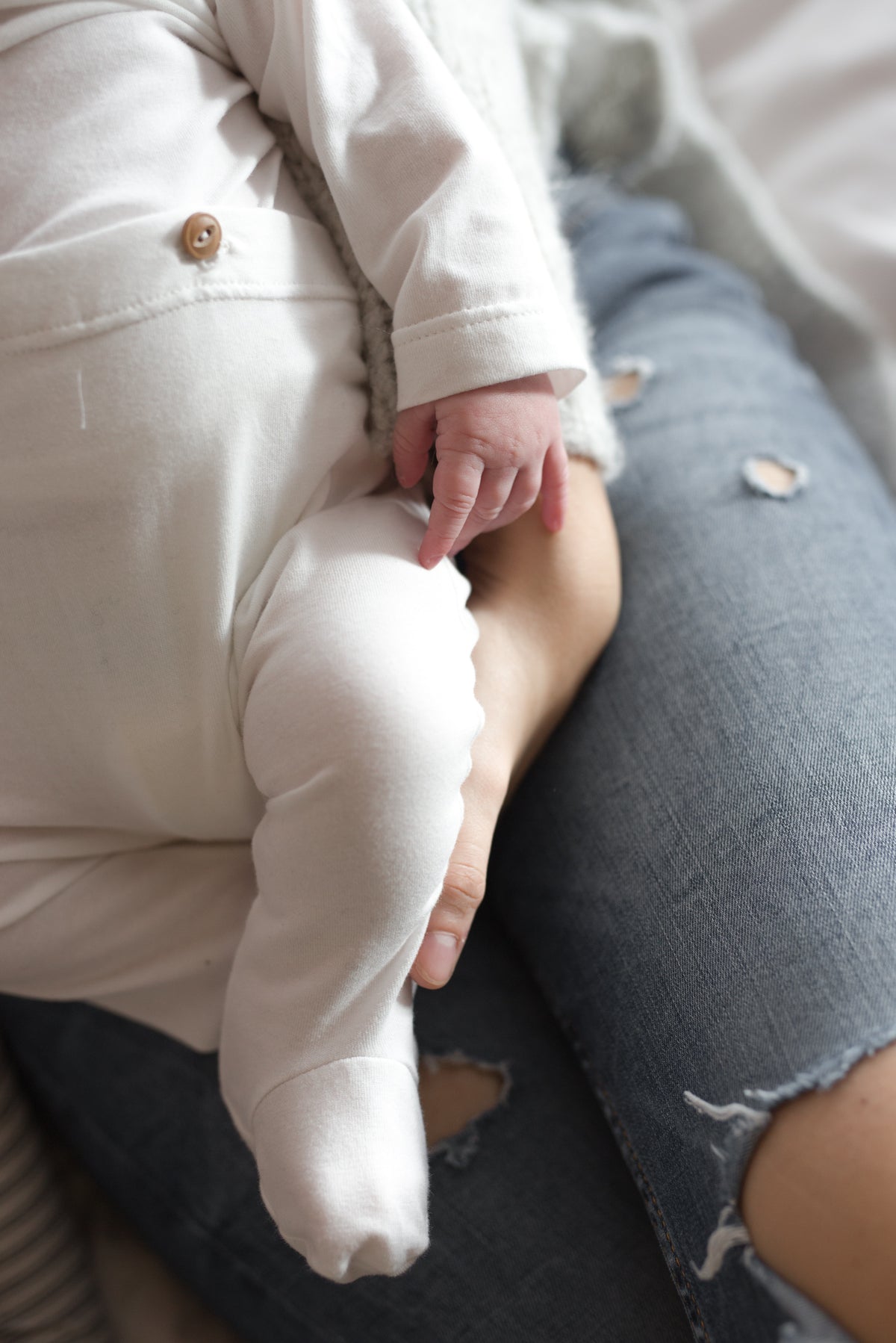 cream jumpsuit on baby